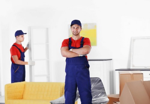 House movers loading furniture in Falconwood residential street