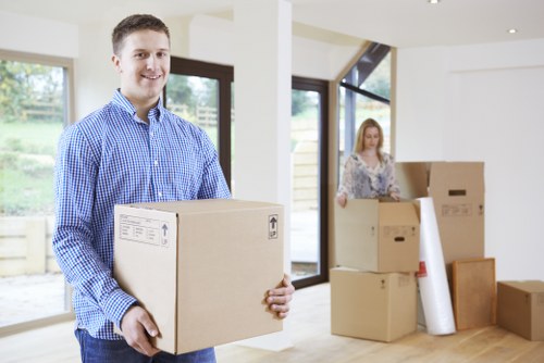 Professional mover handling access challenges on a residential street in Falconwood