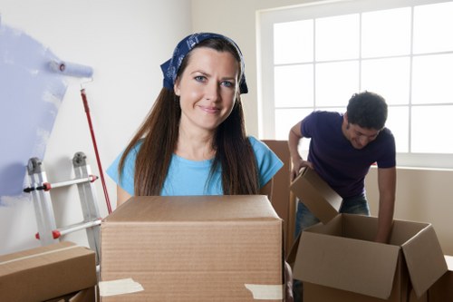 Packed moving boxes and furniture ready for transport