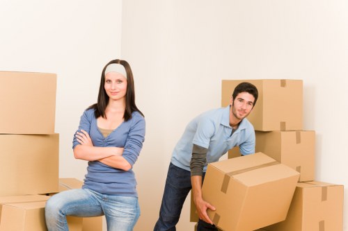 Careful furniture loading by movers in Falconwood
