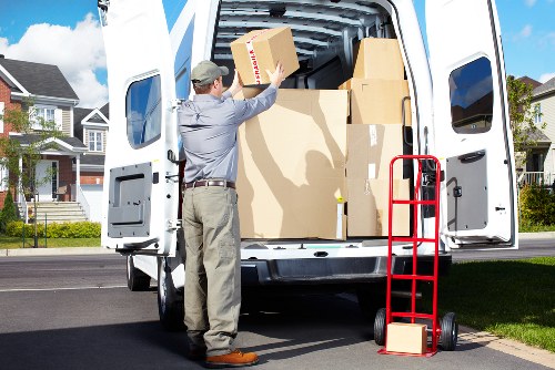 Packed boxes and wrapped furniture prepared for removals in Falconwood