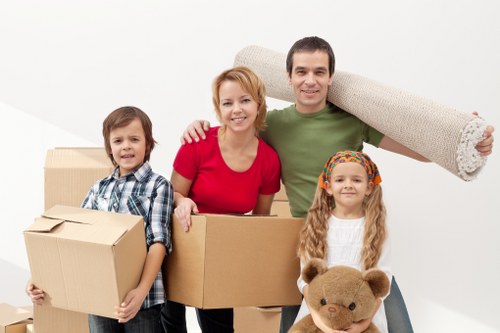 Loading household items into a van in Falconwood