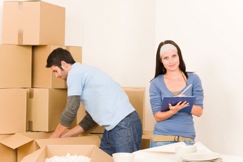 Loading furniture into a moving truck in Falconwood