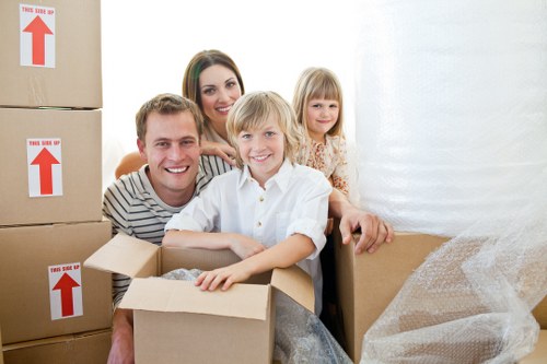 Local movers preparing fragile items and furniture for transport